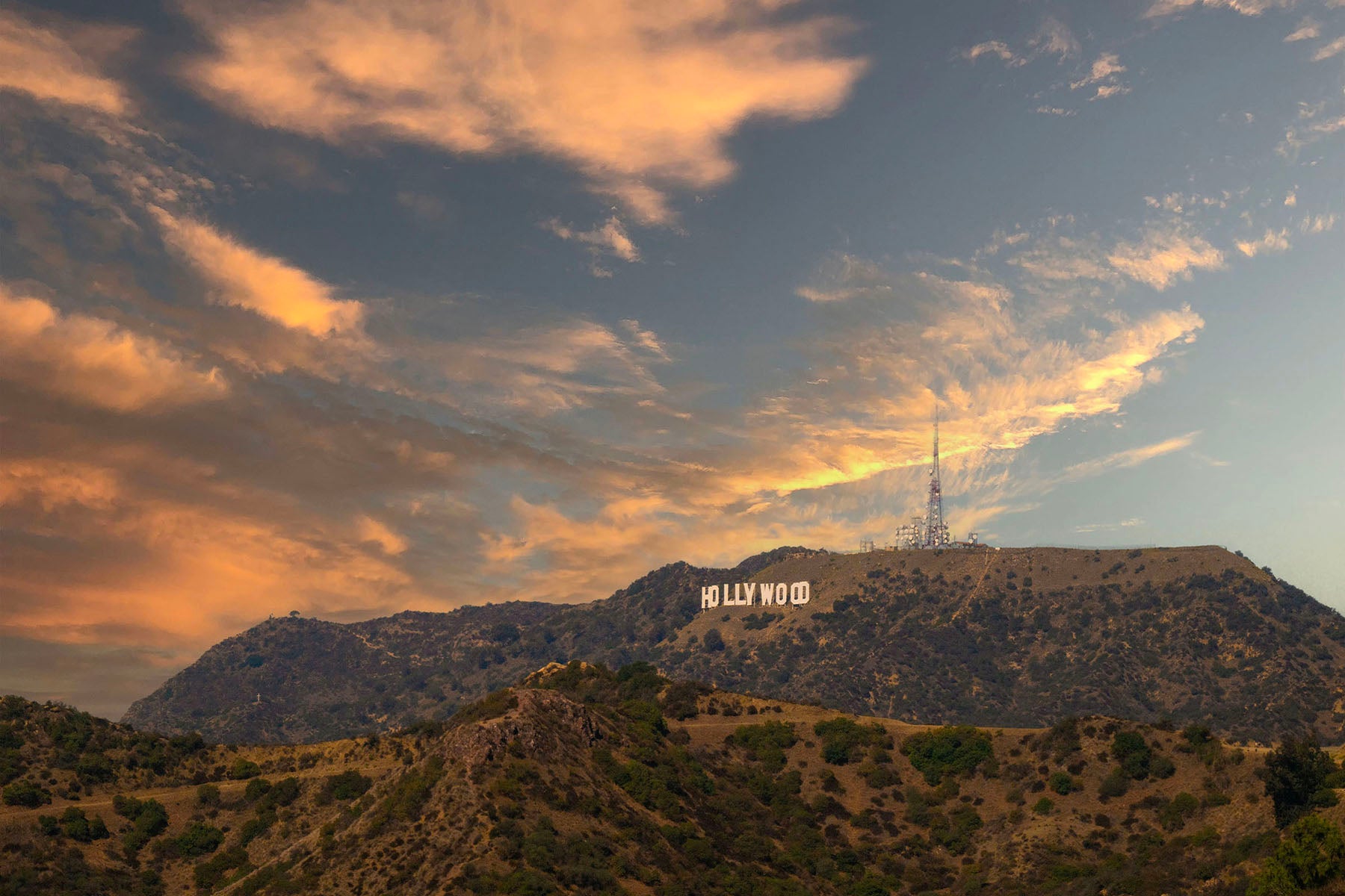 Hollywood sign on a mountain with a sunset sky. Print by Lisa Lake Photography.